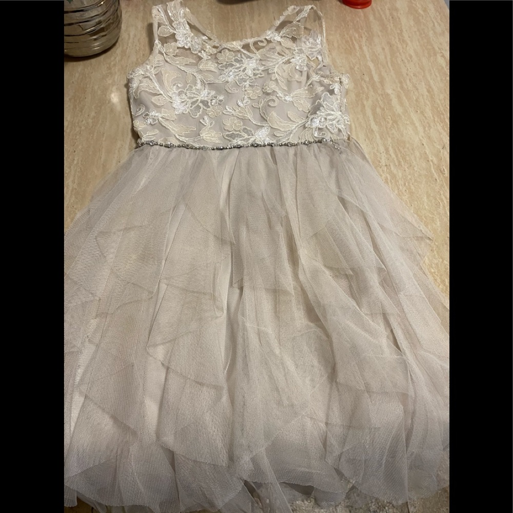 A cute creme color dress for special occasions